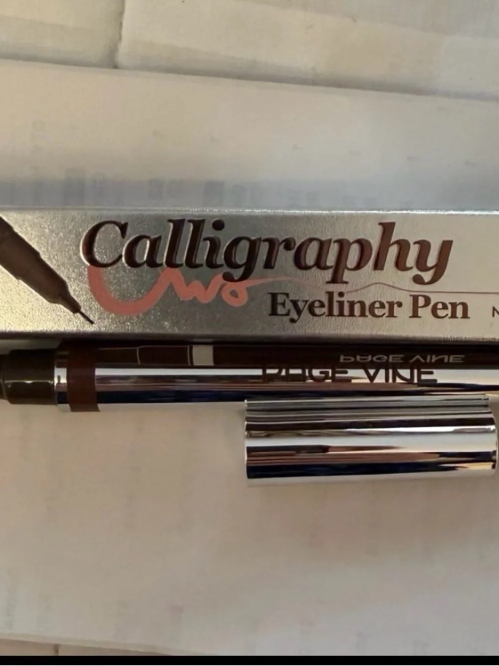 Pagevine calligraphy eyeliner pen in a brown shade.